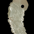 A WHITE JADE HUMAN FIGURE AND DRAGONS PENDANT