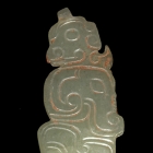 A WHITE JADE HUMAN HEAD AND DRAGON-FISH PENDANT