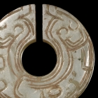 AN INCISED JADE SLIT RING (JUE)