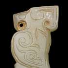 A SMALL WHITE JADE OWL FORM PENDANT