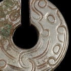 AN INCISED JADE SLIT RING (JUE)