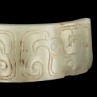 A JADE ARC SHAPED ORNAMENT WITH CRESTED BIRDS