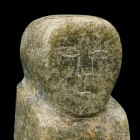 A MOTTLED GREEN JADE STANDING FIGURE