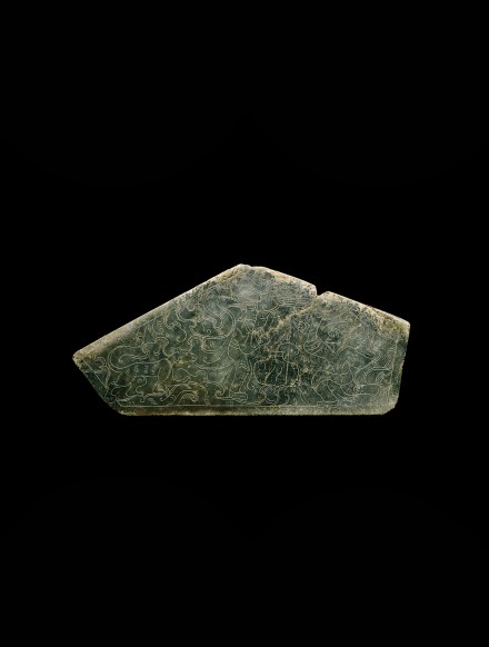 AN INCISED GREEN JADE PLAQUE