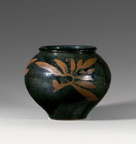 A RUSSET-PAINTED BLACK-GLAZED JAR