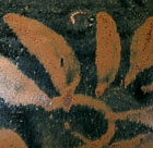 A RUSSET-PAINTED BLACK-GLAZED JAR