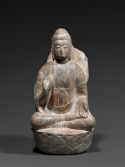 A LIMESTONE FIGURE OF BUDDHA ON A LOTUS THRONE