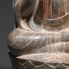 A LIMESTONE FIGURE OF BUDDHA ON A LOTUS THRONE