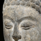A LIMESTONE HEAD OF BUDDHA
