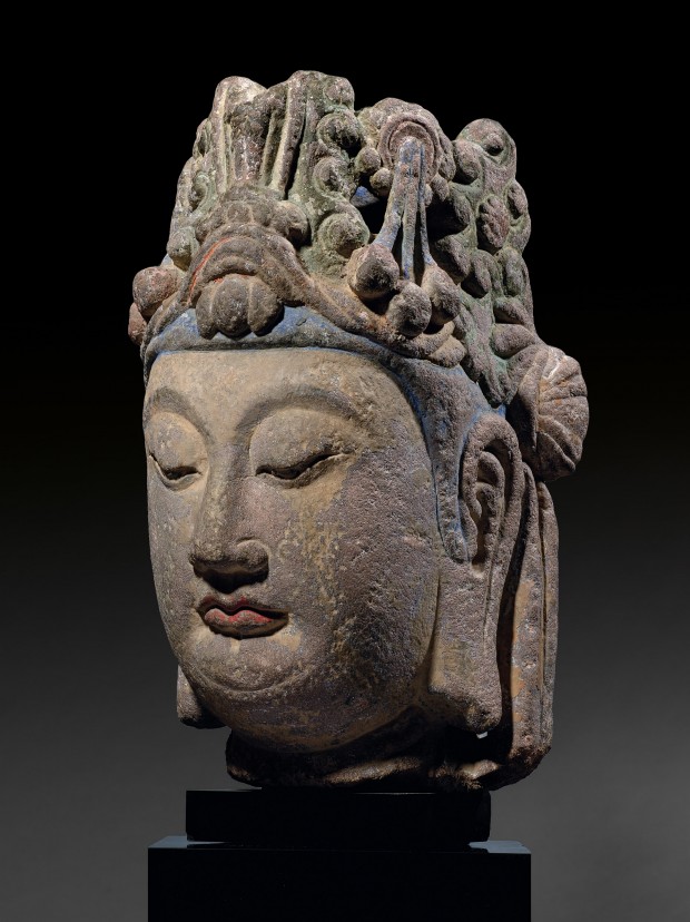 A LARGE SANDSTONE HEAD OF A BODHISATTVA