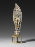 A GILT BRONZE FIGURE OF ELEVEN-HEADED GUANYIN