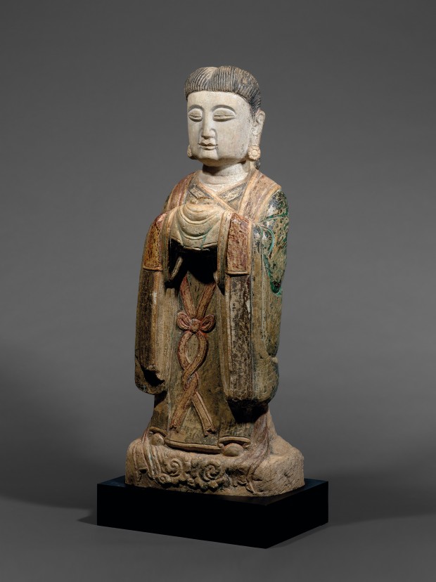 A PAINTED MARBLE FIGURE OF AN ATTENDANT DEITY