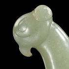 A NEOLITHIC JADE BIRD HEAD PENDANT