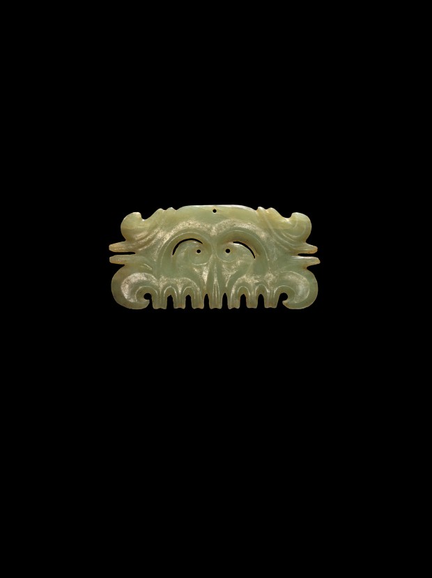 A NEOLITHIC JADE TOOTHED MASK ORNAMENT