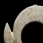 A NEOLITHIC JADE NOTCHED DISC (YABI)