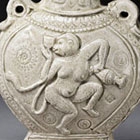 A MOULDED WHITE POTTERY ‘DANCING MONKEY’ FLASK (BIANHU)