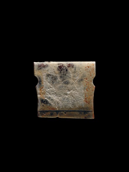 A NEOLITHIC JADE ORNAMENT WITH INCISED MASK