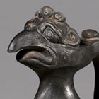 A BLACK BURNISHED POTTERY ‘PHOENIX-HEAD’ EWER