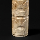 A CARVED NEOLITHIC JADE CYLINDRICAL BEAD