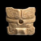 AN ARCHAIC JADE MINIATURE TAOTIE FORM ORNAMENT