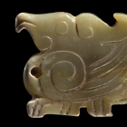 AN ARCHAIC JADE BIRD PENDANT