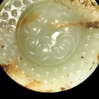 AN ARCHAIC JADE SWORD POMMEL (SHOU)