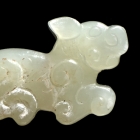 A PAIR OF ARCHAIC JADE DRAGON BEADS