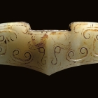 AN ARCHAIC JADE SWORD GUARD (GE)