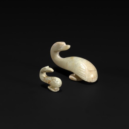 TWO SMALL ARCHAIC JADE GARMENT HOOKS