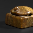 AN ARCHAIC BROWN JADE TORTOISE SEAL