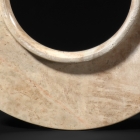 AN ARCHAIC JADE COLLARED DISC (YUAN)