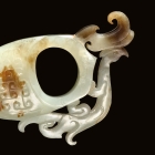 AN ARCHAIC JADE ‘ARCHER’S RING’ ORNAMENT