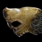 AN ARCHAIC JADE ANIMAL HEAD FINIAL