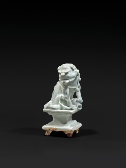 A QINGBAI GLAZED PORCELAIN BUDDHIST LION