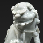 A QINGBAI GLAZED PORCELAIN BUDDHIST LION