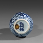 A SMALL MING BLUE AND WHITE PORCELAIN DOUBLE-GOURD ‘DRAGON’ VASE