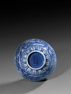 A MING REVERSE-DECORATED BLUE AND WHITE PORCELAIN ‘DRAGON’ BOWL