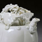 A WHITE PORCELAIN MELON-SHAPED EWER