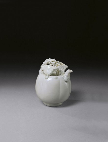 A WHITE PORCELAIN MELON-SHAPED EWER