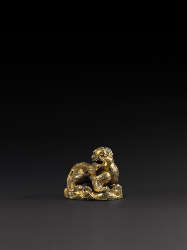 A GILT BRONZE ‘QILIN’ MAT WEIGHT