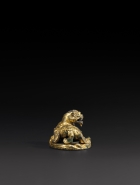 A GILT BRONZE ‘QILIN’ MAT WEIGHT