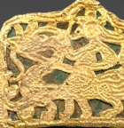 AN OPENWORK GOLD PLAQUE