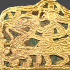 AN OPENWORK GOLD PLAQUE