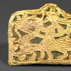 AN OPENWORK GOLD PLAQUE