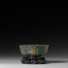 A GREEN JADE BUDDHIST ‘PURE WATER BOWL’