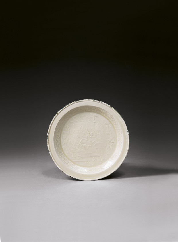 A MOULDED DINGYAO WHITE PORCELAIN ‘DUCKS-IN-LOTUS-POND’ DISH