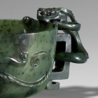 AN IMPERIAL GREEN JADE ‘DRAGONS’ WINE CUP